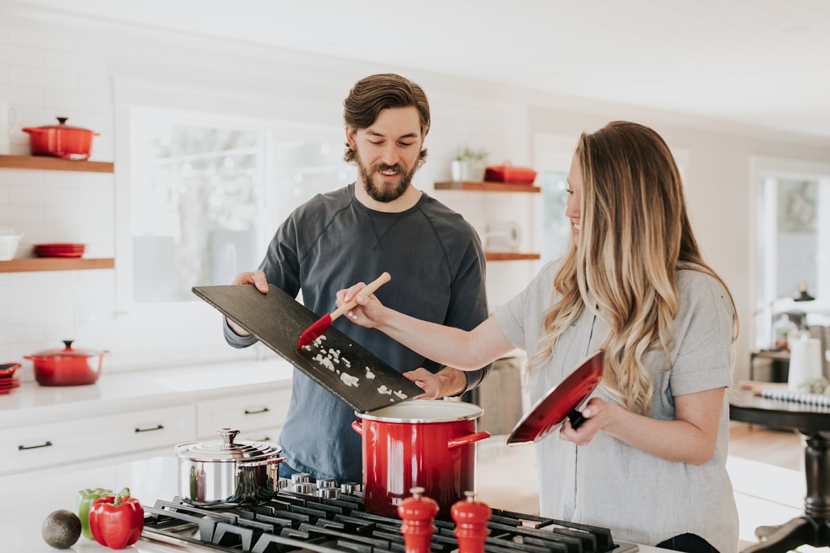 First-time homebuyers reviewing a home together in the kitchen